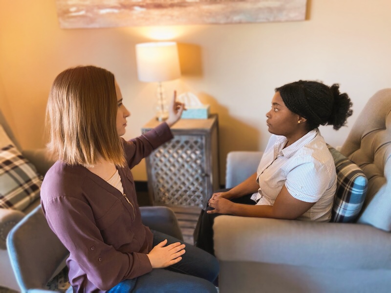 therapist has a client follow her fingers with her eyes and offers a client EMDR therapy to resolve trauma and anxiety. Get EMDR in cincinnati, OH