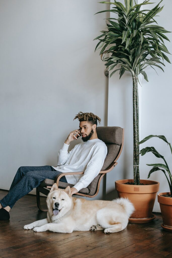 A young black man talks on his cellphone while petting a dog in his home. This peaefulness represents the relief you may feel after addressing erectile dysfunction in Cincinnati, OH. We offer erectile dysfunction treatment in Kentucky, erectile dysfunction treatment in Indiana and more! 45208