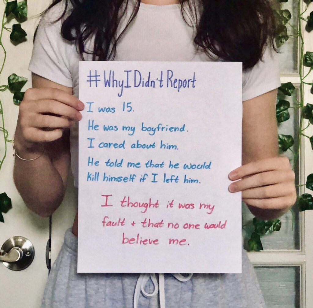 photo of a woman holding a piece of paper that says "#why I didn't report. I was 15. He was my boyfriend. I cared about him. He told me that he would kill himself if I left him. I thought it was my fault and that no one would believe me." This represents the mindset of many sexual assault survivors. Get sexual trauma treatment in Cincinnati, OH with emma schmidt and associates