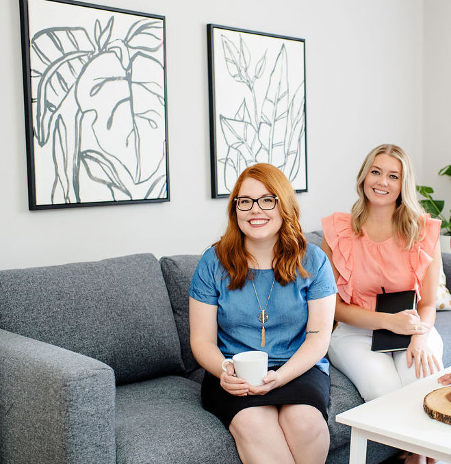 Two therapists smile as they sit in their therapy office with Emma Schmidt & Assoc. Learn more about our upcoming intimacy workshop in Cincinnati, OH. We offer online relationship workshops in Ohio and other services. Contact an online therapist in Ohio to learn more! 45208