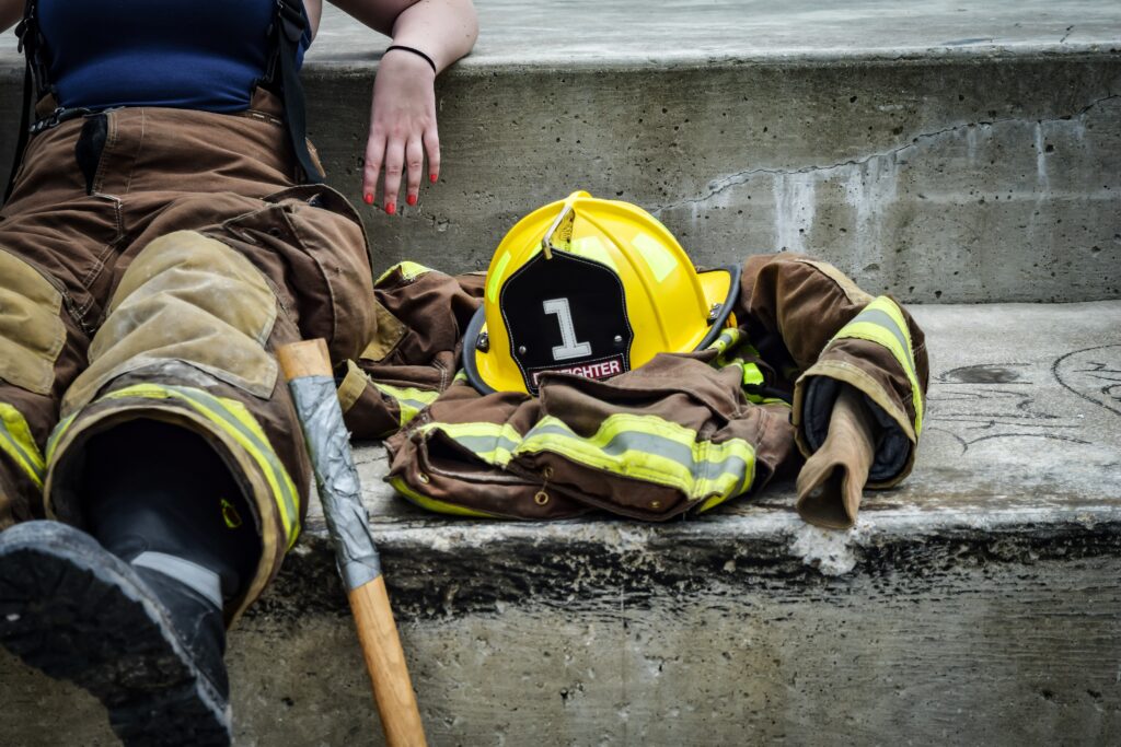 Firefighter clothes rest on a step. Learn how relationship counseling in Indiana can offer support for first responders. We can offer intimacy workshops for couples in Indianapolis, IN and other services. Contact an online therapist in Ohio to learn more.